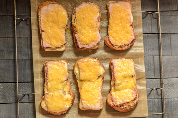 Six sandwiches with meat and cheese top view