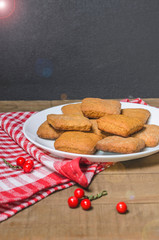 Biscuits, milk, red napkin, Christmas decor with free space for text.