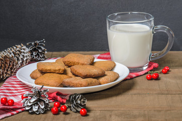 Biscuits, red berries, bumps, gifts, Christmas decor with free space for text. Top view