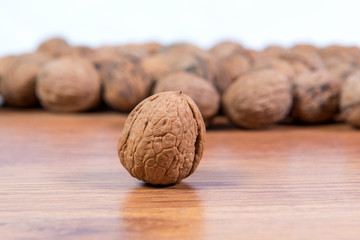 A lot of scattered walnuts close-up. A useful product.