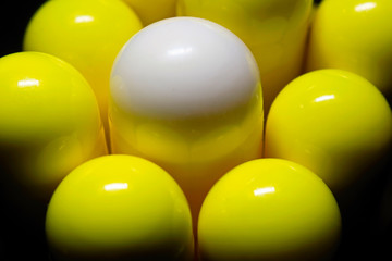 Yellow pill among white macro