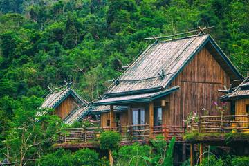 A wooden bamboo house in a rainforest. Sanya Li and Miao Village. Hainan, China.