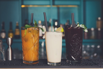 Creative exotic alcoholic cocktails in bar