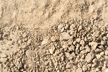 A background of sand and pieces of clay