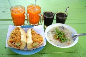 many kind of international breakfast ice tea,hot coffee,sandwich,rice porridge 