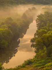 Landscape with small river, foggy morning, sunrise.