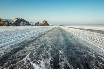 Ice Road through Baikal lake, sunrise, Siberia, Russia.