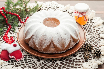 traditional decorated christmas cake at wooden table