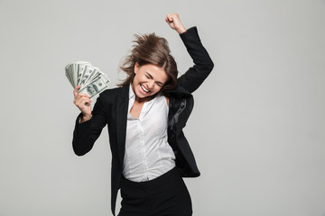 Portrait of a thrilled excited businesswoman in suit