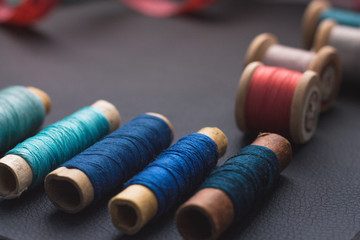 view from above of a black space for notes with sewing thread and other sewing accessories