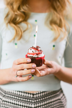 Woman Holding a Birthday Capcake