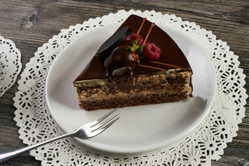 Slice of chocolate cake with chocolate cream