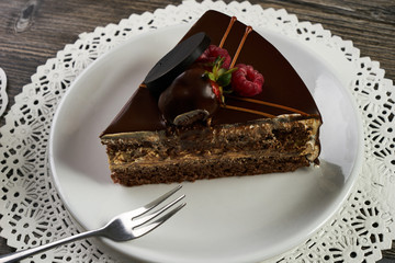 Slice of chocolate cake with chocolate cream