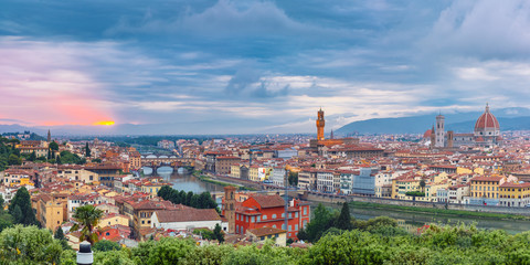 Panoraa of River Arno and famous bridge Ponte Vecchio at sunset from Piazzale Michelangelo in Florence, Tuscany, Italy