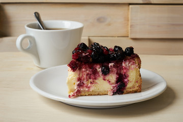 Slice of mascarpone cheesecake with winter berry