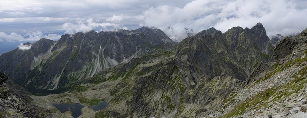 Naklejka na ściany i meble Green lake, High tatras mountains with cloudy atmosphere, Slovakia.