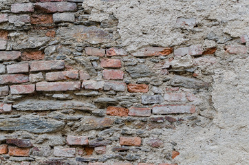 Old wall with red bricks and stones