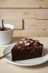 Slice of dark chocolate truffle cream cake