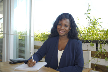 young attractive black African American woman sitting outdoors a