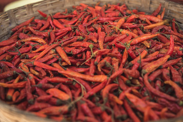 Fototapeta premium Organic dried chili peppers in a wooden basket.
