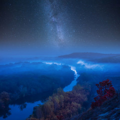 Night autumn landscape with galaxy