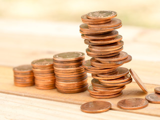 Four rows rising growth golden stack coins with unstable stack different position at last row showing high growth high risk and unstable in business. Growing and saving money concept.