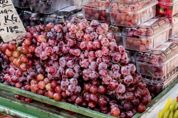 Purple grapes seller at the market