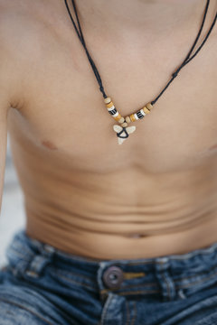A shark tooth pendant souvenir on a necklace