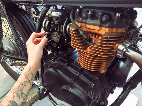 Working on Motorcycle Engine.