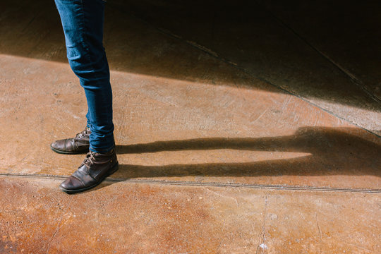 Man Standing in the Street with Brown Boots