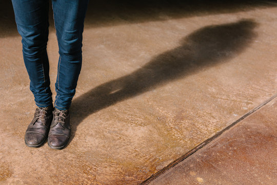 Man Standing in the Street with Brown Boots