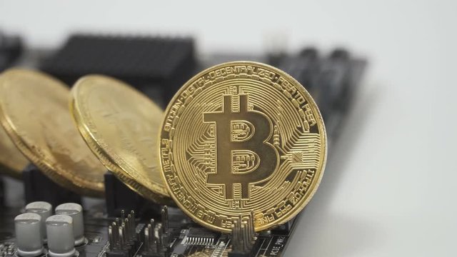 Bitcoins stands on motherboard
