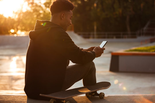 Young African Man Using Mobile Phone