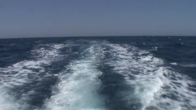Waves and water surface view from bow luxury white yacht ship in Red Sea. Beautiful landscape of wild nature.