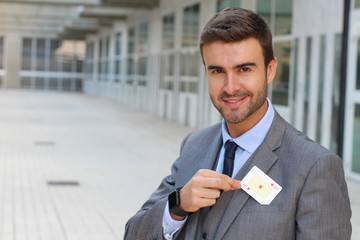 Businessman showing the ace of hearts