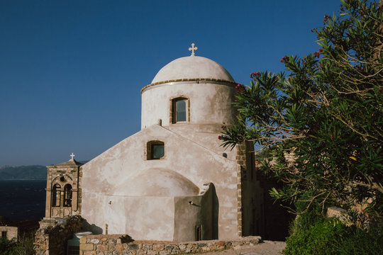 Greek old church with cross.