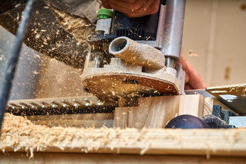Dovetail joint. Woodworking and carpentry production. Part of a wooden box, made with a milling...