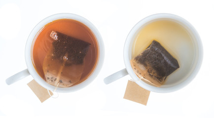 Top view of a cup of tea with tea bag isolated on white background