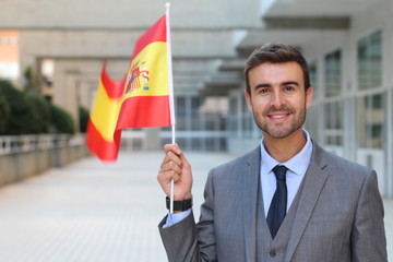 Fototapeta premium Proud man waving the Spanish flag