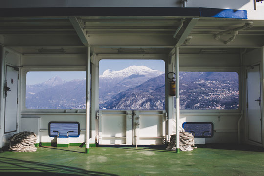 View of the mountains and lake from the windows of the ferry boat