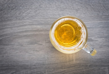 Glass of beer on wooden table,Top view