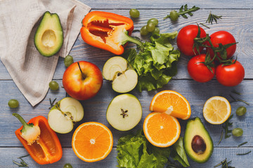 Fresh vegetables on blue wood background, copy space