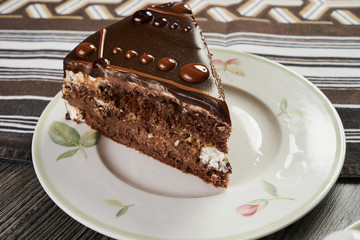 Slice of chocolate cake and cup of tea