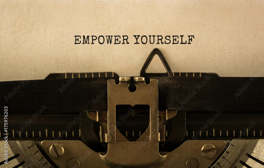 Poster text empower yourself typed on retro typewriter