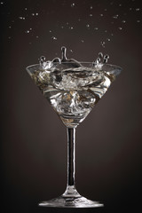 Cocktail Splashes Serie in 5 different colors with an Olive making different shapes in the martini: Grey