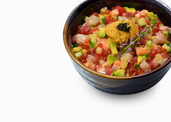 Mixed sashimi don (maguro, otoro, salmon, sea bass, hamachi, uni) on white background. Japanese food. Copy space