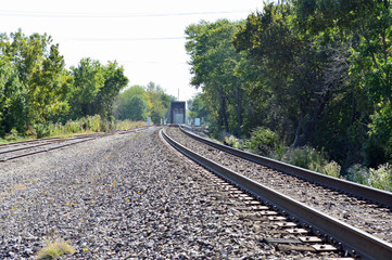 Fototapeta na wymiar Train tracks following around the bend to the bridge ahead