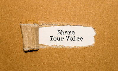 The text Share Your Voice appearing behind torn brown paper