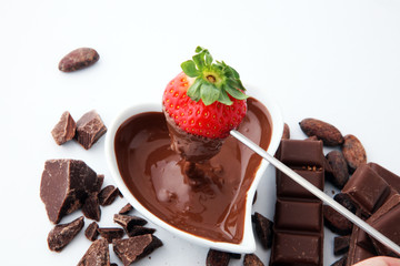 Fondue with Melting chocolate or melted chocolate and strawberry.