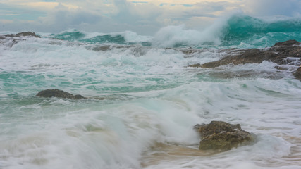 Big ocean wave breaking the shore